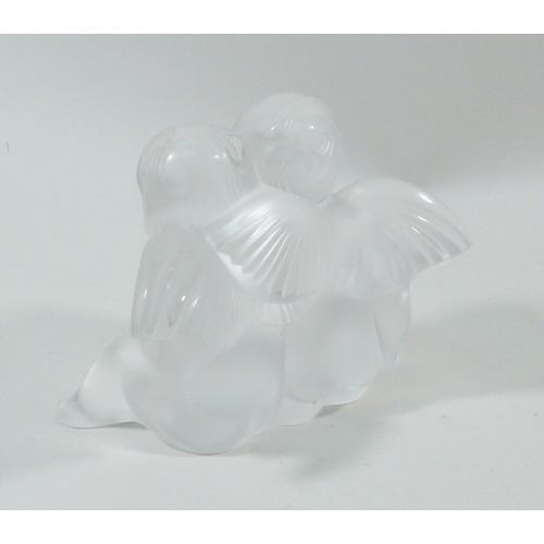 140 - A Lalique girl & boy angel paperweight, a/f chipped.  82mm tall.