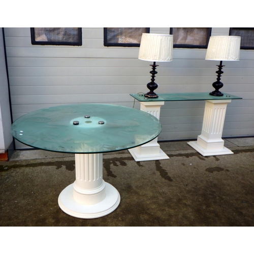 706 - A circular glass topped dining table together with a glass topped side table, top drilled for lamp w... 