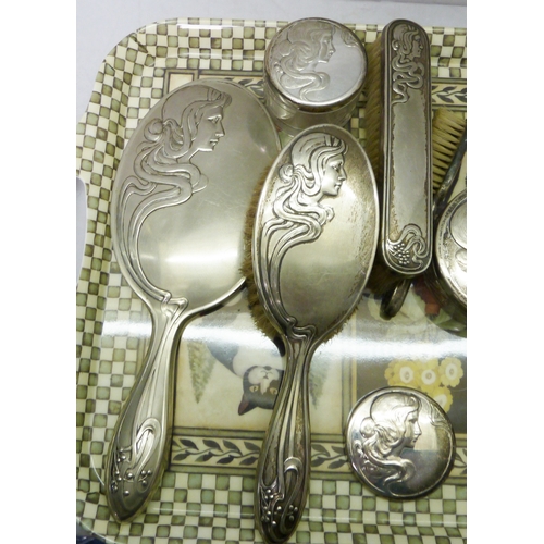 104 - A German Art Nouveau silver plated dressing table set (10)