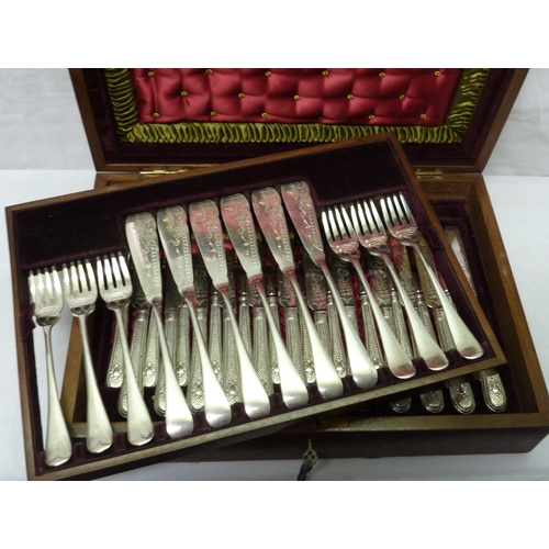 105 - An inlaid fitted case containing a set of six silver plated fish knives and forks and a set of twelv... 