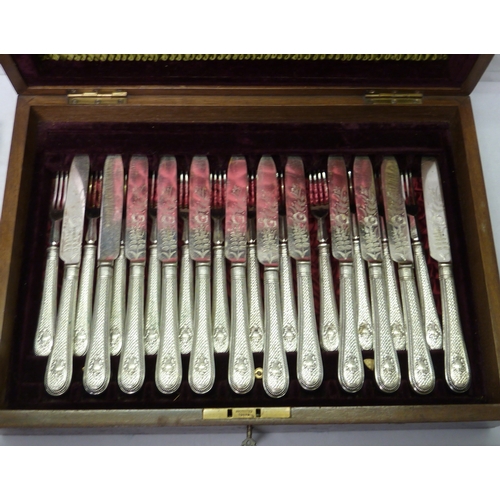 105 - An inlaid fitted case containing a set of six silver plated fish knives and forks and a set of twelv... 