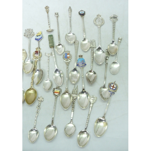 108 - A collection of silver, white metal and silver plated souvenir teaspoons, etc.  200gr weighable.