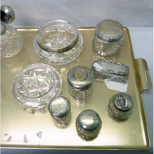 48 - Ten various silver topped cut glass jars; a cut glass jar and cover having a silver rim; a silver to... 