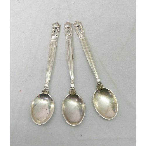 99 - Three matching Georg Jensen silver coffee spoons; a cased silver coronation anointing spoon; a pair ... 