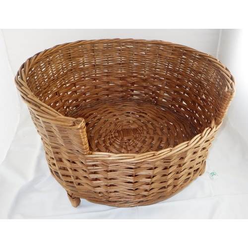 30 - A large wicker dog basket 60cm diameter 36cm high