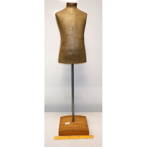 55 - A small mannequin on stand