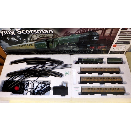 97 - A Hornby Model Railway Flying Scotsman part train set, boxed; together with an associated model rail... 