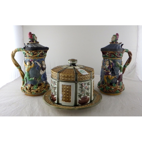 178 - A pair of Minton Majolica ewers 32cm tall together with a Wedgwood cheese dome, af