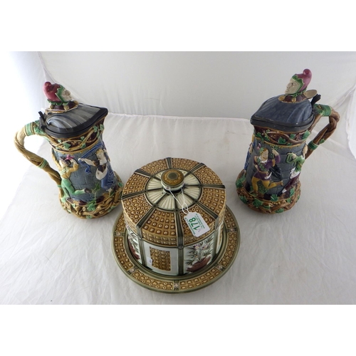 178 - A pair of Minton Majolica ewers 32cm tall together with a Wedgwood cheese dome, af