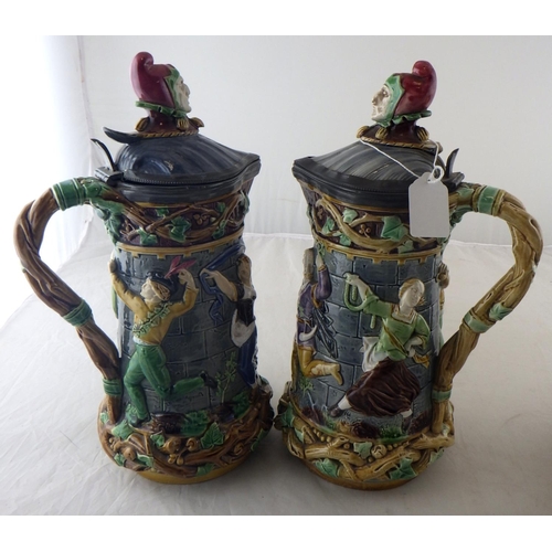 178 - A pair of Minton Majolica ewers 32cm tall together with a Wedgwood cheese dome, af