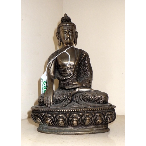 19 - A Chinese silvered bronze Buddha 20cm tall