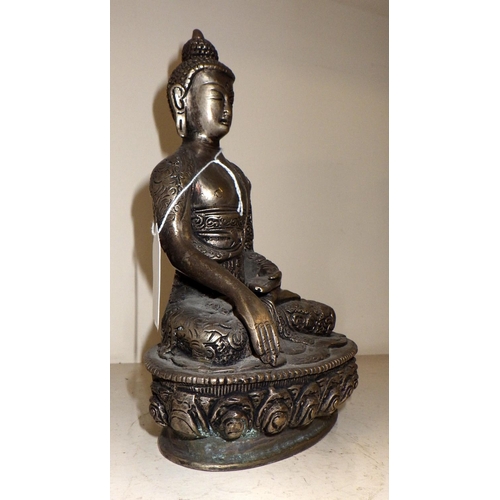 19 - A Chinese silvered bronze Buddha 20cm tall