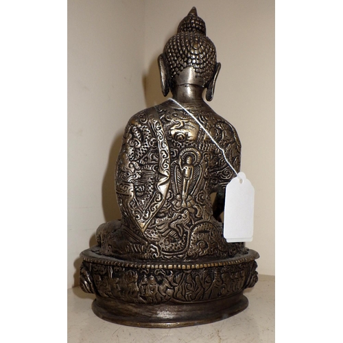 19 - A Chinese silvered bronze Buddha 20cm tall