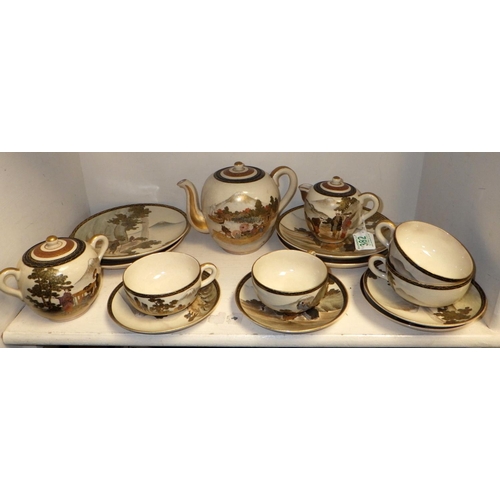 29 - A Satsuma part tea set to include tea pot, sugar bowl, four side plates and four cups & saucers