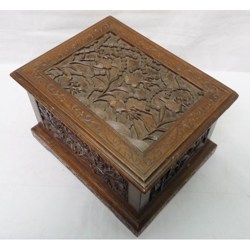 34 - An Oriental motif tea caddy, carved hardwood with a pewter liner.