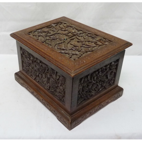 34 - An Oriental motif tea caddy, carved hardwood with a pewter liner.