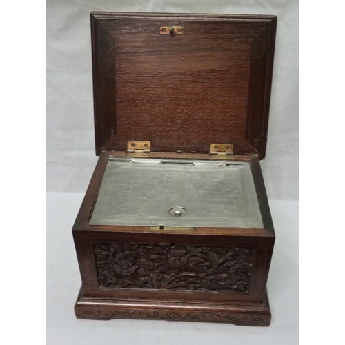 34 - An Oriental motif tea caddy, carved hardwood with a pewter liner.