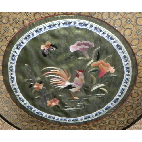 41 - A framed Chinese silk work roundel bearing a cockerel motif, 38cm sq, presented in an oxford frame.