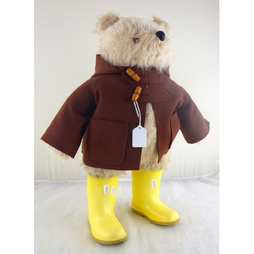 10 - A Paddington Bear by Gabrielle Designs, c1972, brown coat and yellow wellies, lacking hat.