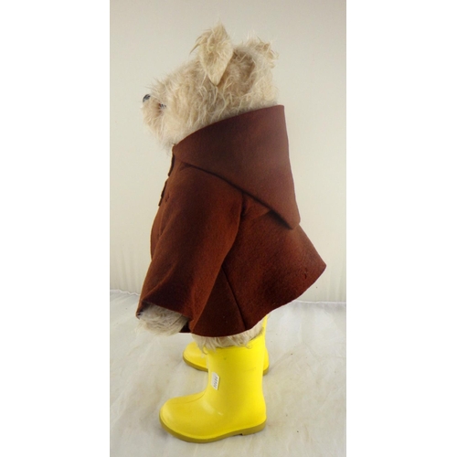 10 - A Paddington Bear by Gabrielle Designs, c1972, brown coat and yellow wellies, lacking hat.