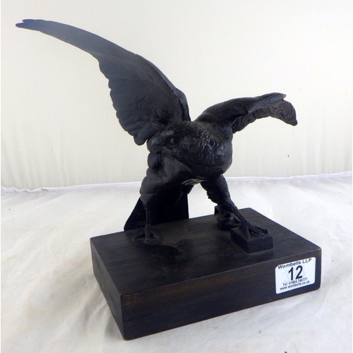 12 - A bronze depicting a hawk.  29cm across wings.