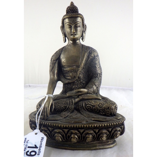 19 - A Chinese silvered bronze Buddha 20cm tall