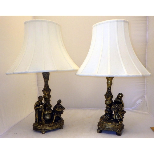 31 - Two table lamps, a pair of binoculars, carved soapstone figurines, modern collectors shoe models.