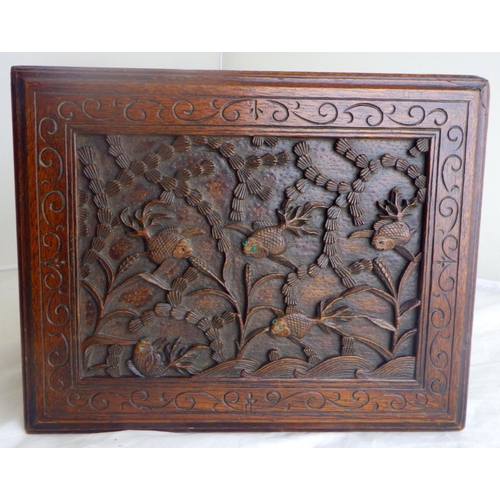 34 - An Oriental motif tea caddy, carved hardwood with a pewter liner.