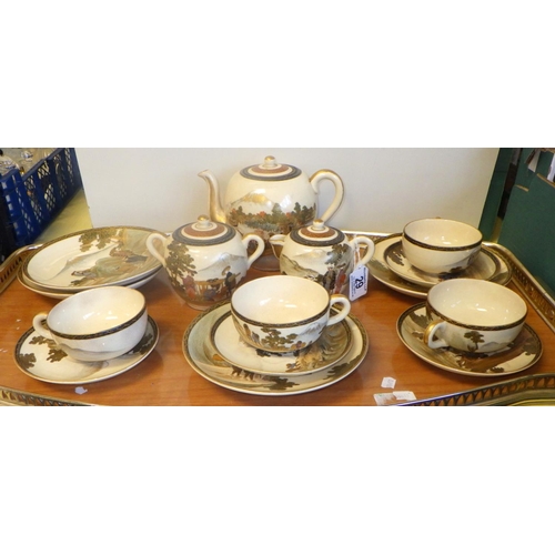 29 - A Satsuma part tea set to include tea pot, sugar bowl, four side plates and four cups & saucers