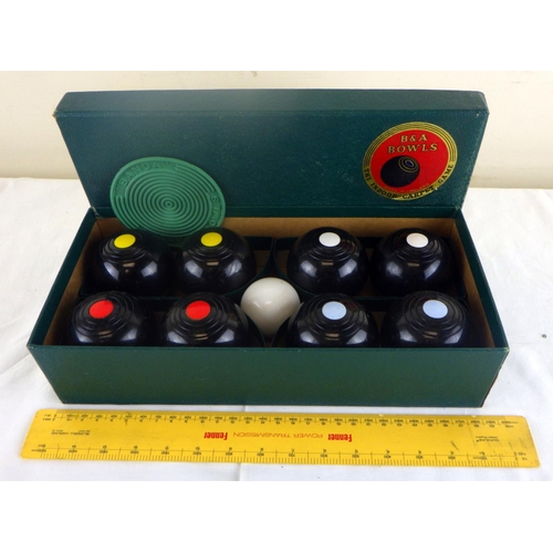 295 - A Boxed set of carpet bowls by Brookes & Adams Ltd