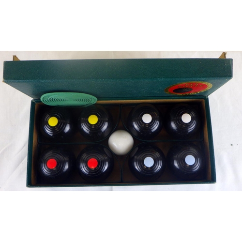 295 - A Boxed set of carpet bowls by Brookes & Adams Ltd