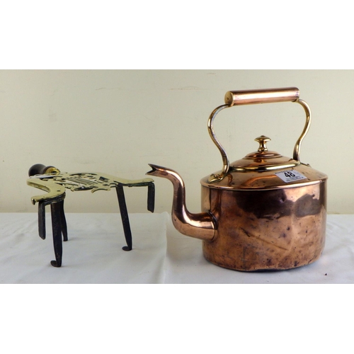 48 - A Victorian copper kettle on brass hearth trivet with wooden handle (2).