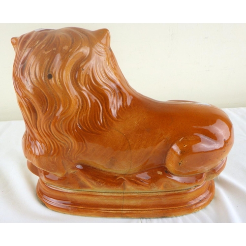 49 - A 19th century Staffordshire lion 25cm high and 30cm long.