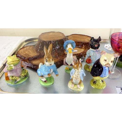 57 - A collection of Various Beatrix Potter animals, all af together with a David Wallace glass bottle et... 