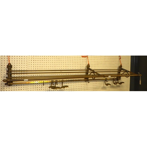 66 - A brass luggage / coat bracket 126cm wide 28cm deep