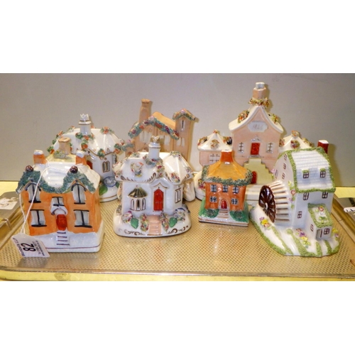 82 - A group of Staffordshire cottages to include a Coalport mill (8)