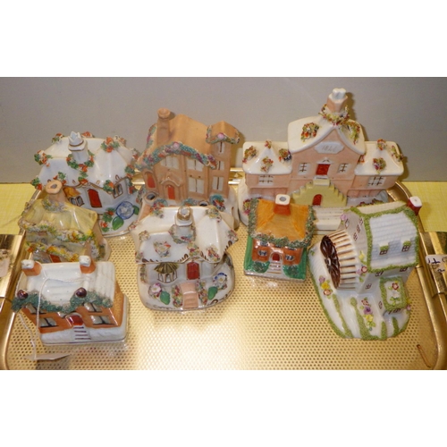 82 - A group of Staffordshire cottages to include a Coalport mill (8)