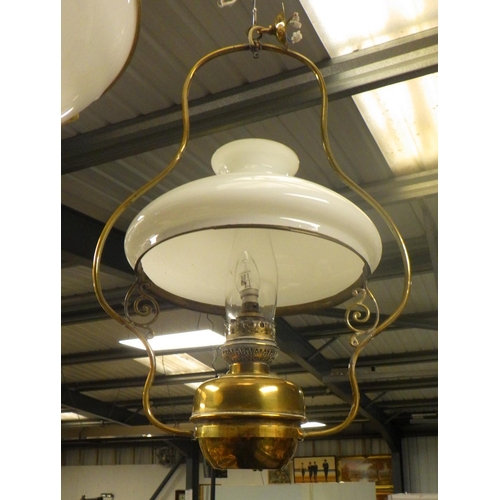 117 - A Converted hanging brass oil lamp with milk white glass shade