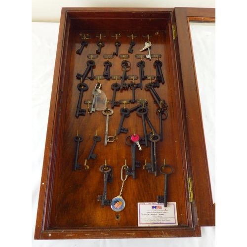 100 - An early 20thC mahogany key cabinet with keys 34 x 63cm