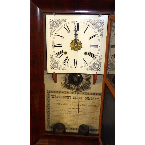 255 - A Waterbury Clock company wall clock 39 x 66cm