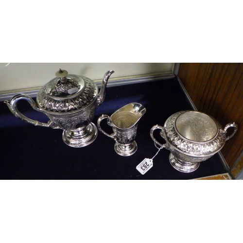 283 - A heavily decorated 3 piece silver plated, repair to handle