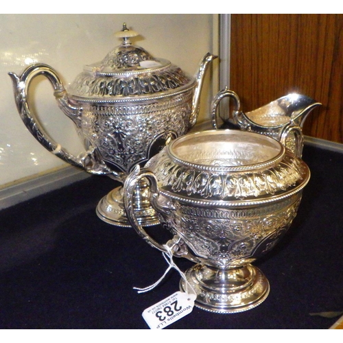 283 - A heavily decorated 3 piece silver plated, repair to handle