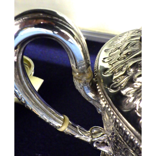 283 - A heavily decorated 3 piece silver plated, repair to handle