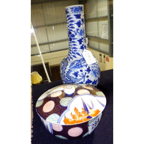 284 - An Oriental blue and white vase 26cm tall together with a carp decorated lidded bowl (2)