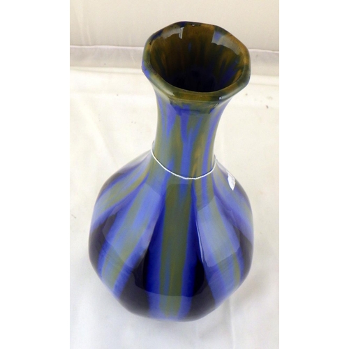 309 - A high fired pottery vase with metal base mount, in the manor of Burmantofts. Stamped 35cm tall