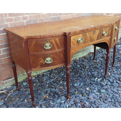 543 - A 19th cen mahogany breakfront sideboard on turned reeded legs, top cracked, 175cm wide, ex The Retr... 