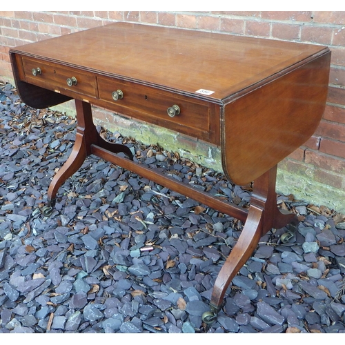 556 - An Edwardian mahogany sofa table, 95cm wide, closed, ex The Retreat (87)