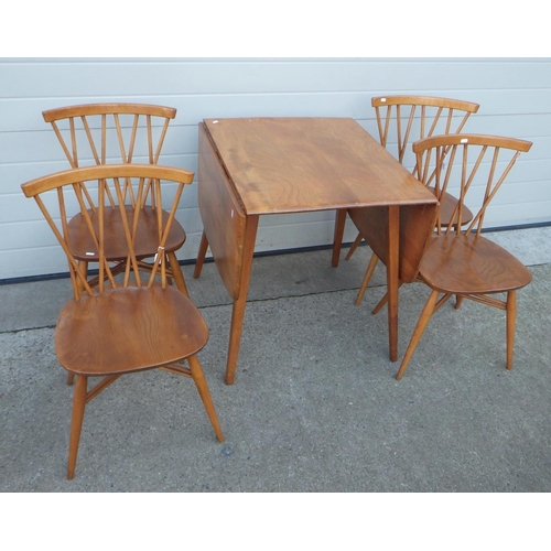 612 - A blonde Ercol drop leaf table, 74cm across & four Shalstone chairs with X spindle backs dated 1960 ... 