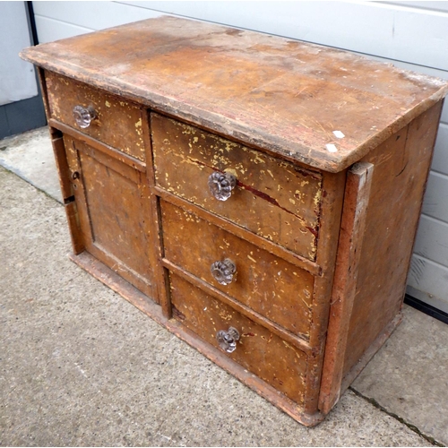 631 - A low pine cupboard a/f damage, 89cm wide