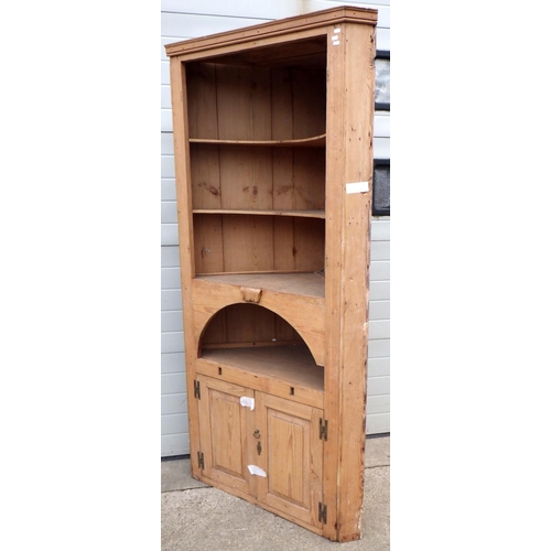 641 - A pine corner cupboard, a/f missing doors, 217cm tall